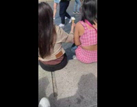 Little girl takes a picture of her mother near London Bridge