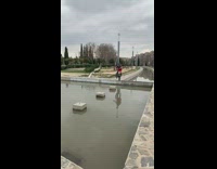 Guy hops across water on bike 