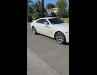 Pink suit guy white roller skates wine