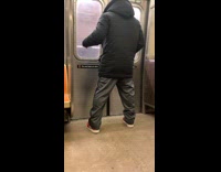 Collab Subway Creatures - Man black jacket playing air guitar on subway while standing
