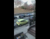 Guy pushes black box down street 