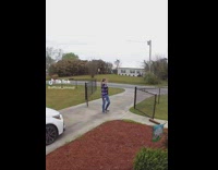 GIrl closes gate before moving car 