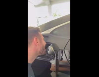 Guy sings karaoke into his fuel tank on car