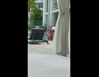 Blonde woman pink bikini stand in pool