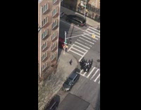 Kid runs around in circles on sidewalk 