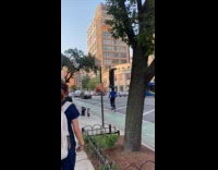 Cyclist blue shirt balance sofa on head