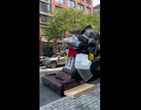 Parked car covered with lots of stuff part 2