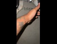 Woman trying to see dogs teeth on balcony 