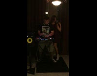 Girl dances near black shirt DJ guy