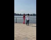 Woman red outfit sunglasses railings photo shoot Part 1