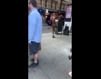 Man wearing thong, gargoyle mask, wings and tail