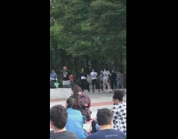 Lady sings opera people learn dance park