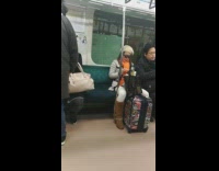 woman with light up glasses on train