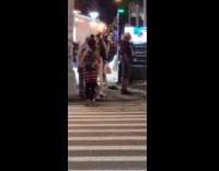 Collab WINY - Man walks with bike and mannequin legs crosswalk