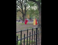 Woman setting up weird props in the middle of park