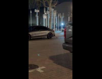 Woman dances on art piece at park