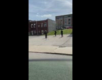 Three people black outfit with red two tripod