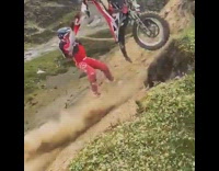 Dirtbiker gets bike over cliff then slides down 