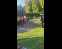 Two people salsa dance man briefs park