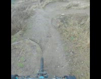 Man action camera mountain bicycle jump trail