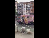 Guy dances by pink ice cream truck 