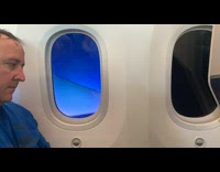 Electrochromic glass window on airplane time lapse