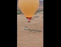 Men Rushes Jumps onto Hot Air Balloon