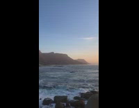 Black dress girl grey beach rocks sunset 