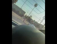 girl on busy palm tree street