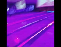 Guy bowls strike green bowling ball alley 