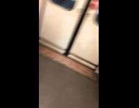 Woman has bag on head on subway