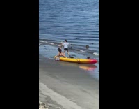Guy and girl twerk beach yellow kayak