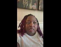 Woman in white shirt and with dark face filter