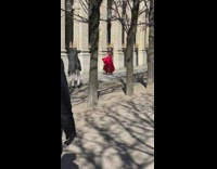 Woman red dress spin wave skirt street