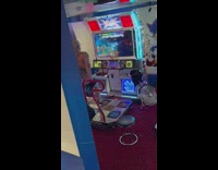 Man play dance dance revolution at arcade