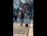 Guys drags tool bag on a skateboard