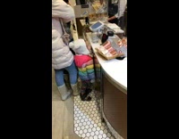 Toddler licks cashier counter 
