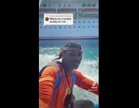 Guy riding jet ski around Carnival cruise ship 