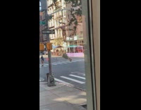 Guy girl hang on streetlight acrobatics rollerblades 