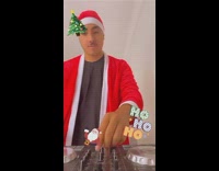 Guy plays Christmas song on DJ turntable