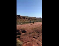 Girls take photo in desert 