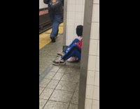 Guy at subway station swipes dating app 