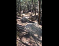 Black helmet guy bicycle grey rock fail 