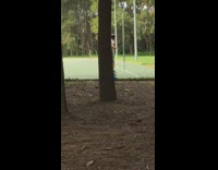 Boy rides two wheel skateboard ripstick on a basketball court at the park