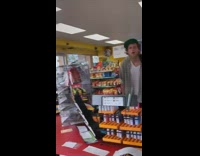 Man makes a rap about weed in front of cash register at a gas station convenience store