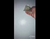 Guy hangs up piece of cheese on hook