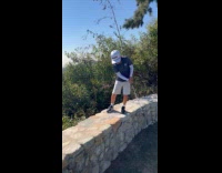 Kid swings from brick wall gets the shot