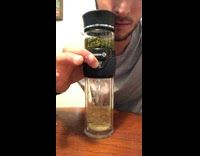 Guy presses button on suction cup and explodes the lid