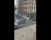 3 guys yell in street 