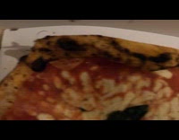 Opened a box with pizza inside of it